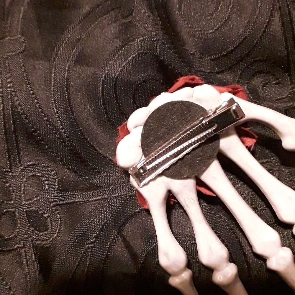 Skeleton hand rose hair clip